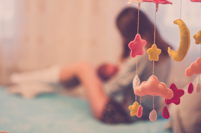 Nursery with mom breastfeeding