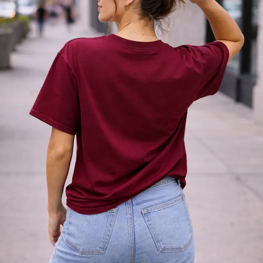 Back view of maroon oversize tshirt styled