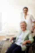 youre-good-hands-with-her-portrait-smiling-caregiver-senior-woman-wheelchair-home.jpg