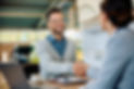 happy-man-handshaking-with-salesperson-while-buyin-2024-12-13-20-45-08-utc.jpg