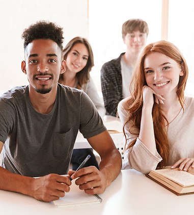 happy-students-sitting-in-classroom-indoors-lookin-2025-02-15-12-08-17-utc.jpg