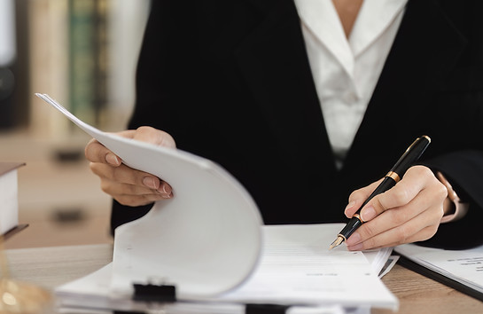 professional-female-lawyer-reviewing-contract-docu-2025-01-16-13-28-34-utc.jpg