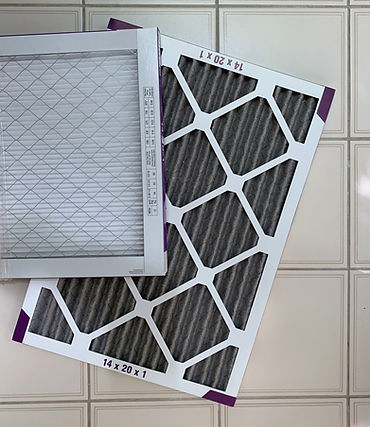 new-and-used-air-filters-on-tiled-floor-2026-03-17-20-16-46-utc.jpg