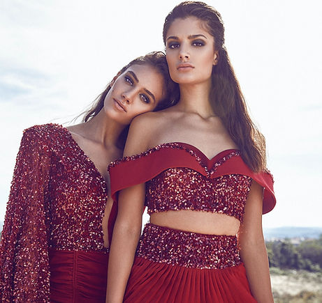 woman leaning to woman wearing dresses_e