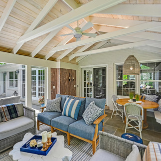 Screened-in porch with natural light and greenery