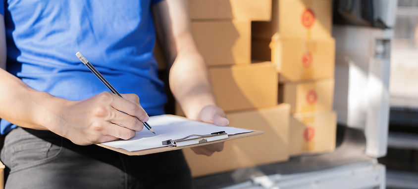 delivery-driver-taking-notes-on-clipboard-2026-03-17-01-19-59-utc.jpg