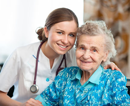 Nurse caring for older woman