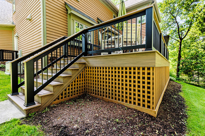 Close-up of TimberTech Classic Composite Drink Rail with English Walnut top rail by OnDeck