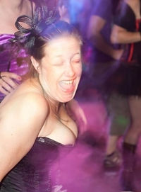 Woman partying at burlesque-themed wedding