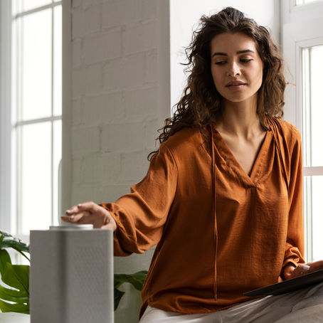 woman-working-from-home-and-using-air-purifier