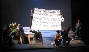 Prisoners on the roof holding banner saying sorry for the death of Walter Scott