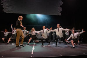 Mr Clark choreographing West Side Story cast in rehearsals