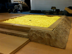 Brown stone surround for ball pool