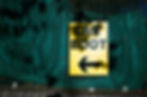 A sign post pointing to a car boot