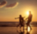 Father and children playing on the beach at the sunset time_ Concept of friendly family__j