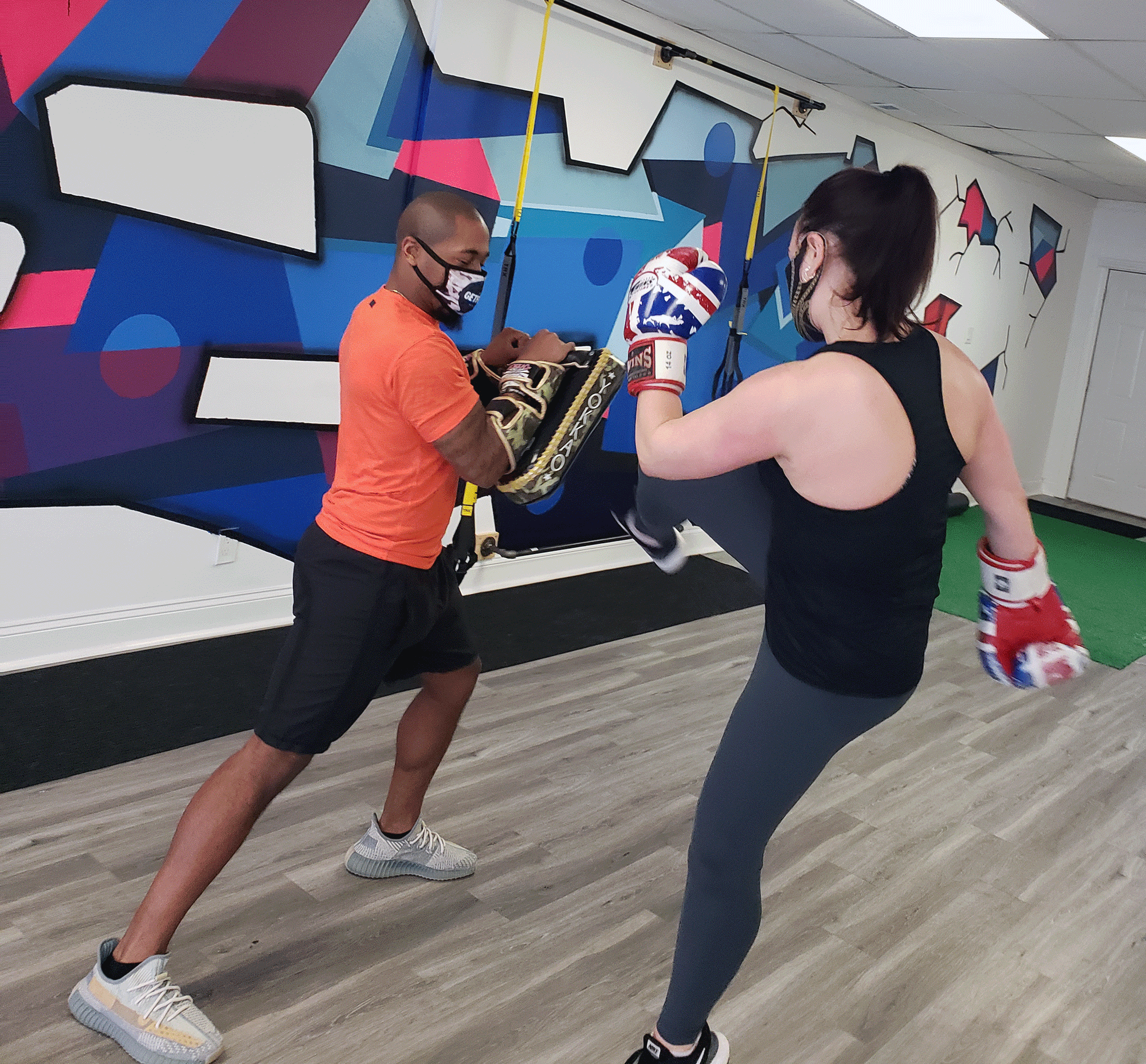 Two people kickboxing 