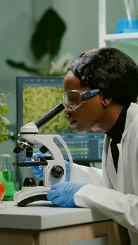 biologist-woman-examining-biological-slide-medical-expertise-using-microscope.jpg