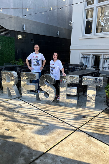 A man and a woman in white T-shirt
