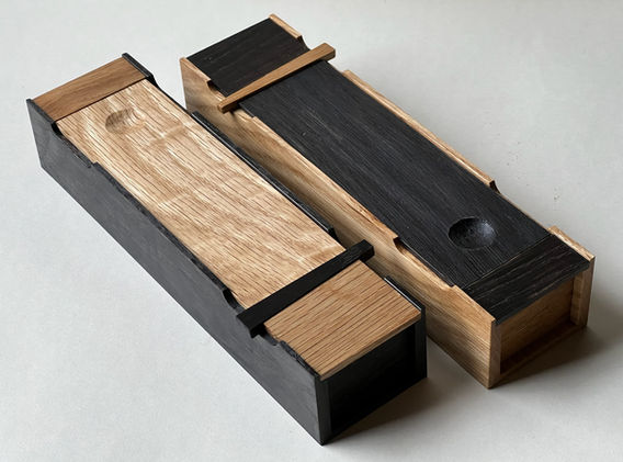 Pencil cases in natural and ebonized white oak.