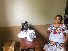 Mayan Embroider by her sewing machine