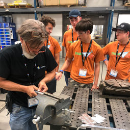 a GoCreate tool tech clamping a piece for a team of boy scouts in wichita kansas