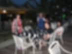 family sat around outside at table, kuah town, langkawi