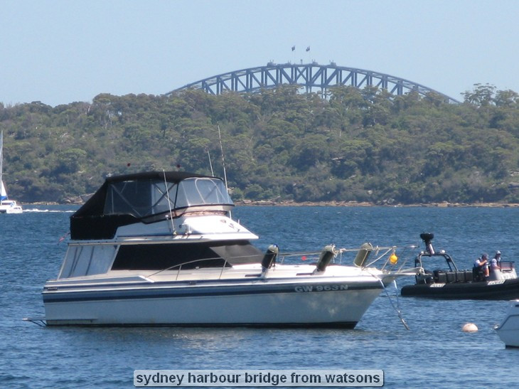 Boat on water with Sydney Harbour Bridge background.