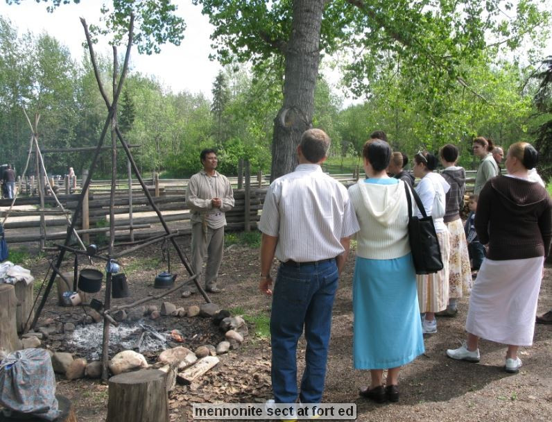 Group gathered outdoors for a historical demonstration.