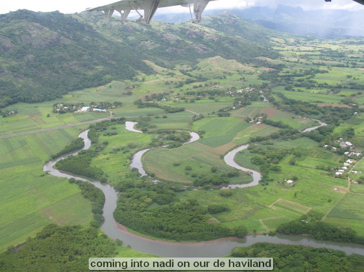 Aerial view of winding river and lush landscape.