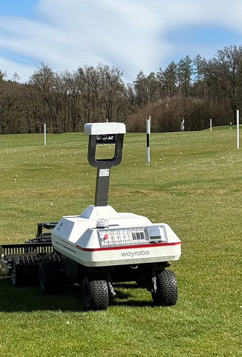 WayPick 2 robotic golf ball picker collecting golf balls during live range operations