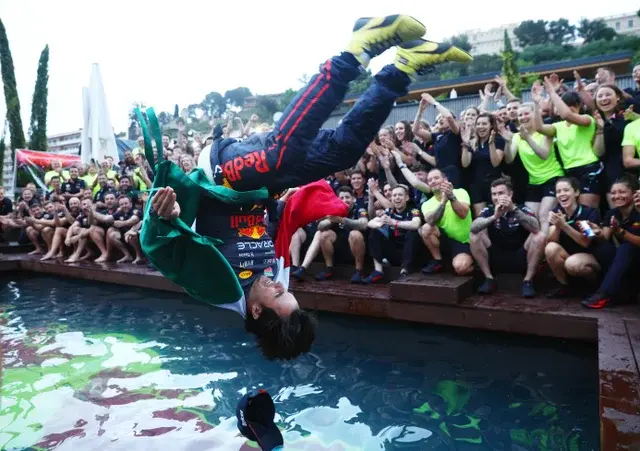 sergio-perez-celebrates-with-his-team-by-jumping-into-the-v0-p1a7kzplsg291.webp