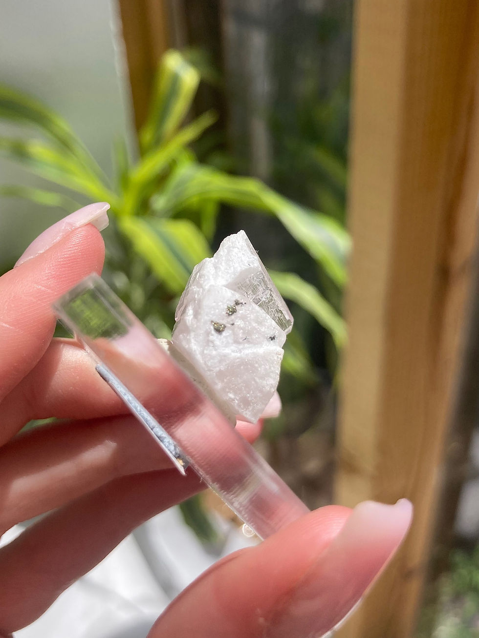 Thumbnail: pink danburite with chalcopyrite specimen on stand