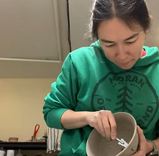 Lady E carving a cherry berry colander
