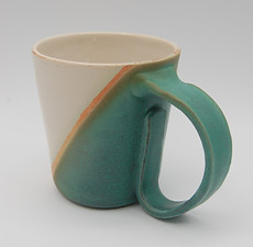 green and white two-tone mug with handle