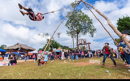 akha-tribe-playing-with-the-wooden-swing-on-akha-swing-festival-RH1WP3.jpg