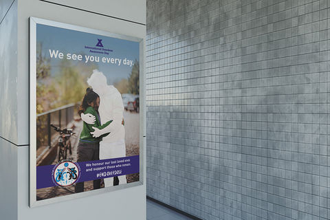 Sign Design for Overdose Awareness de[picts a ghost of a person hugging a girl