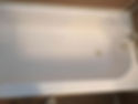Top view of a clean, white porcelain bathtub.