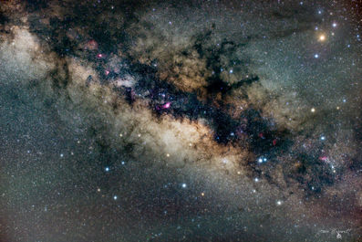 A breathtaking photograph capturing the luminous heart of the Milky Way galaxy. The image reveals the dense galactic core in stunning detail, with swirling clouds of cosmic dust, glowing nebulae, and countless stars scattered across the night sky. The composition of the core evokes a sense of infinite scale and quiet wonder, drawing the viewer into the vastness of space. Perfect as a statement piece, this photographic print brings the beauty and mystery of the universe into any interior, inspiring awe and contemplation.