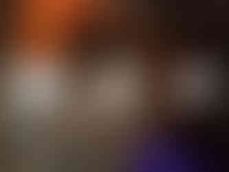 a wooden building with a ladder and the letter m on it