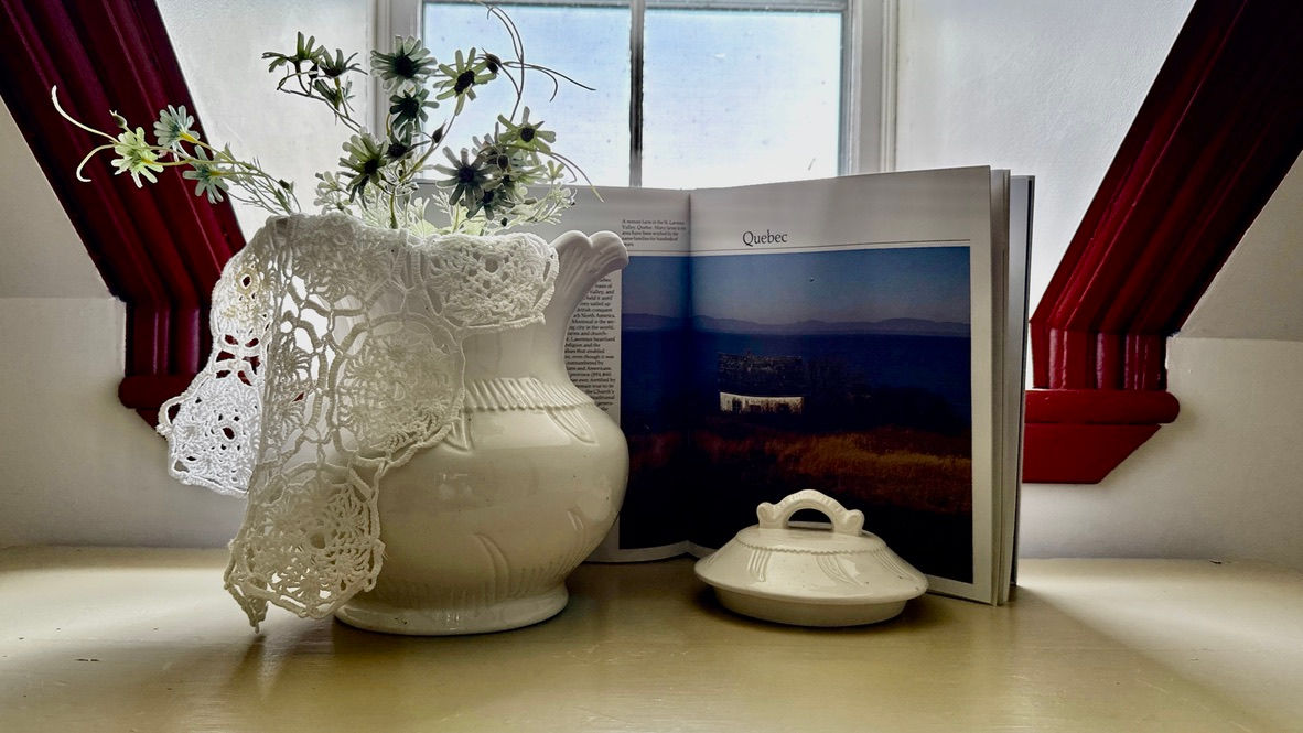vase and book about quebec at Countryside retreat accommodation at Northfork Farm Quebec – rustic farmhouse stay for Ontario & Québec travellers