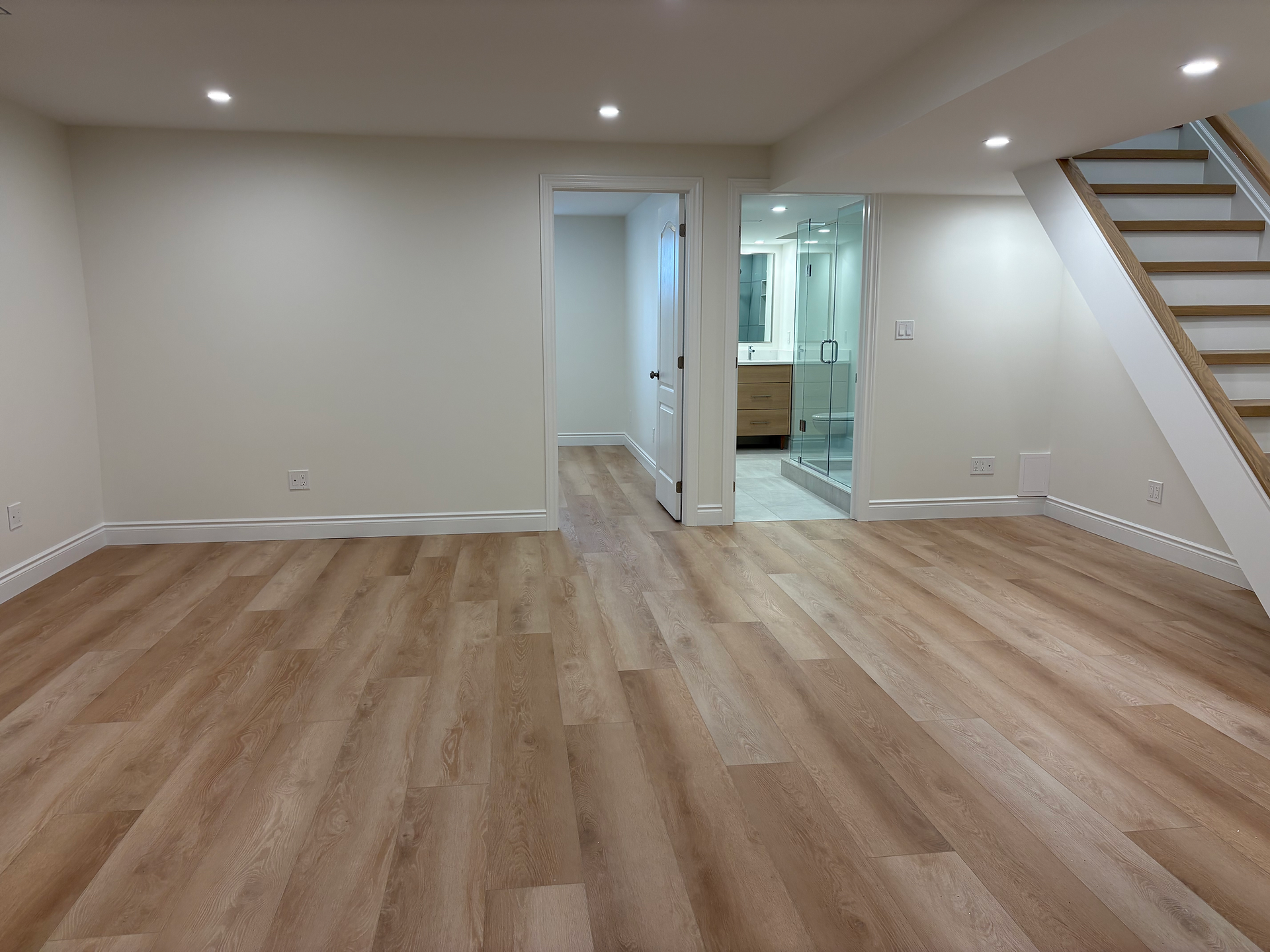 Oakville basement finishing project with upgraded electrical, flooring and lighting