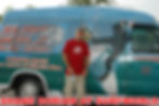 Shane Dorian posing in front of Surf World Surf Shop van.
