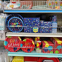 Colorful party plates and napkins on store shelves