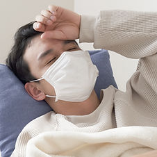 風邪の症状が長引く男性