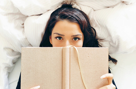 Girl Reading on Bed