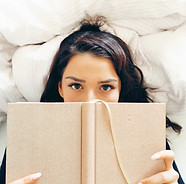 Girl Reading on Bed
