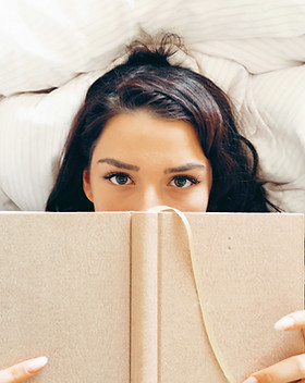 Girl Reading on Bed