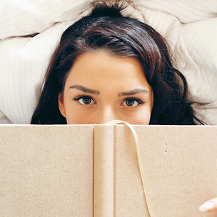 Girl Reading on Bed