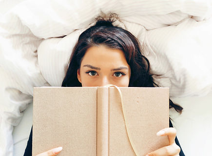 Girl Reading on Bed