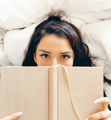 Girl Reading on Bed
